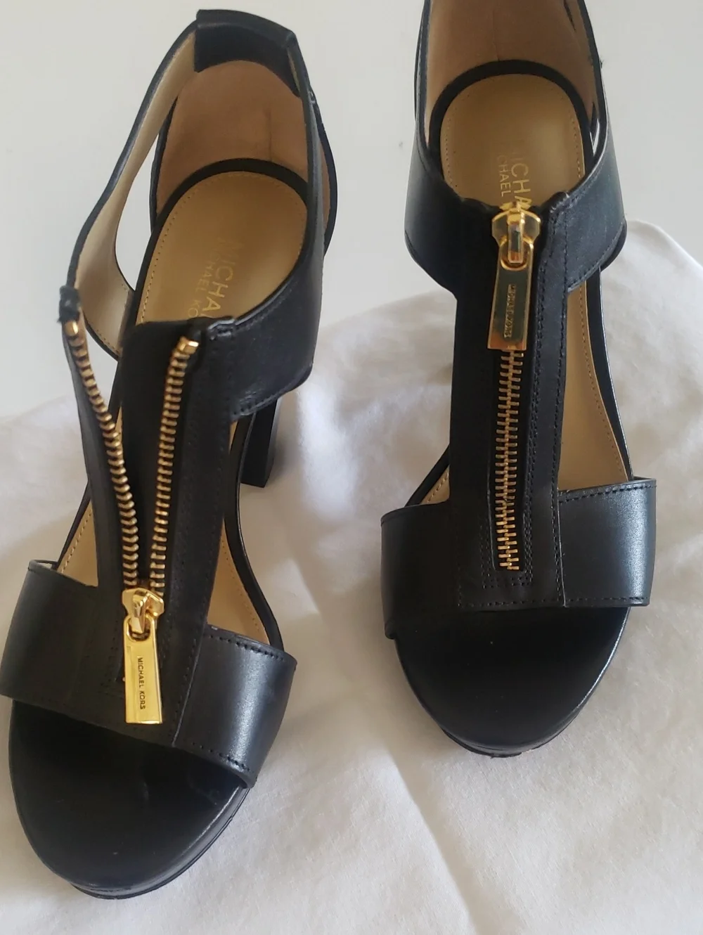M8chael Kors Women’s Black Strappy Sandal with Gold Zip Accent